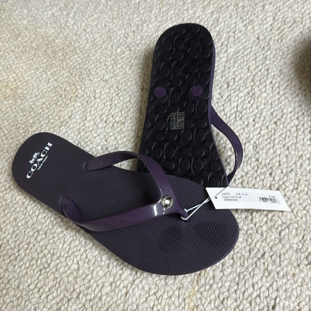 Coach flip flops.  NWT size 8